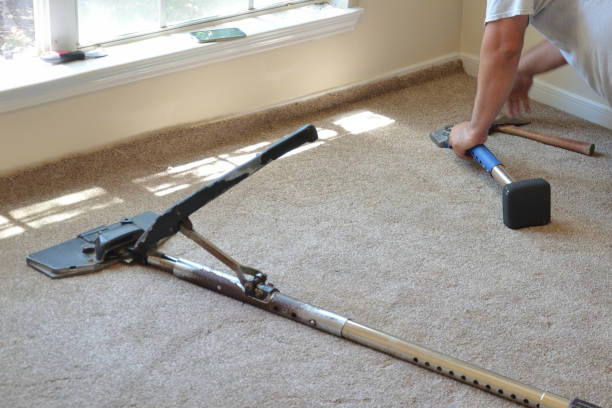 working installing new carpet