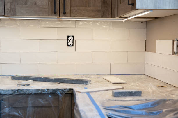 White subway tile backsplash installation for a home renovation project.